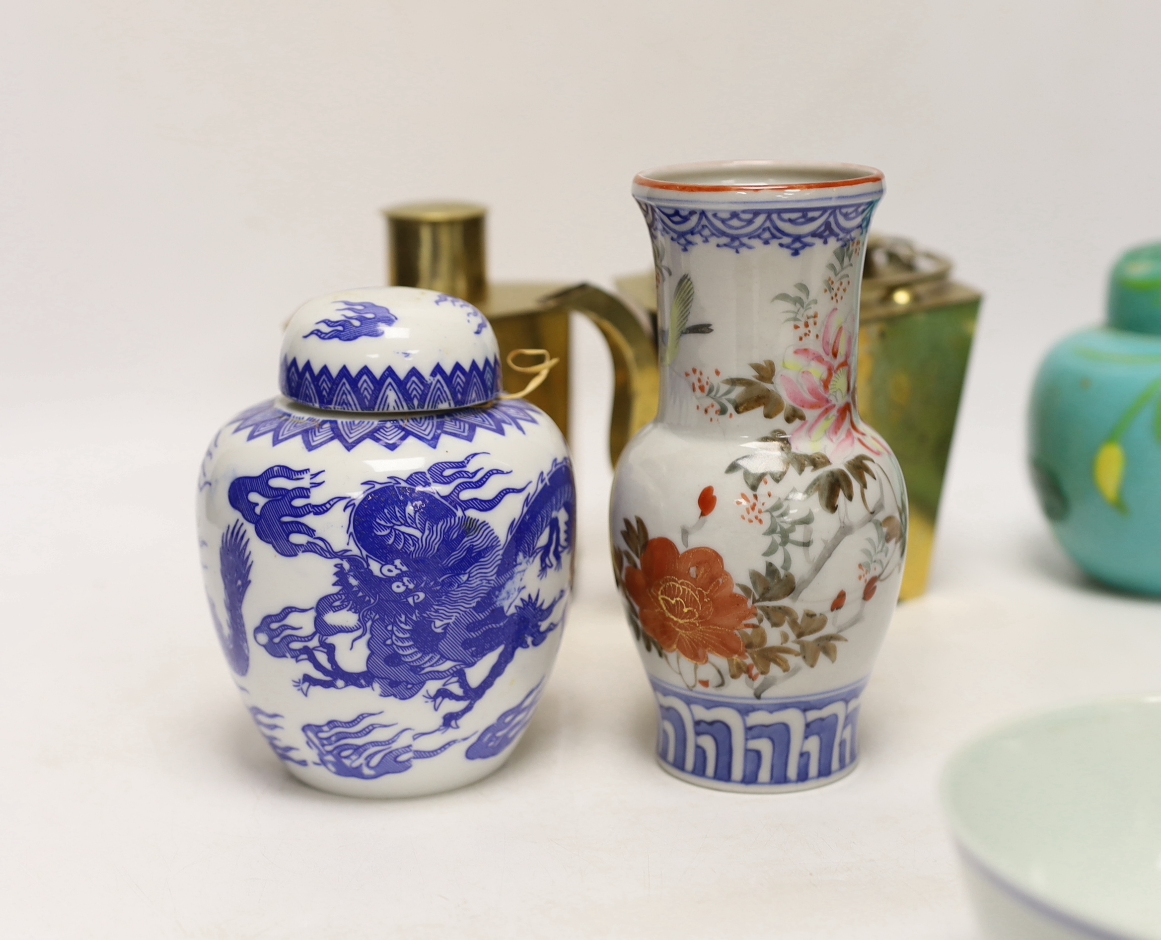 Chinese items including a brass tea caddy and kettle, blue and white porcelain bowls and a Japanese vase